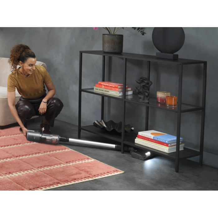 Cordless cleaner designed for easy cleaning under furniture.