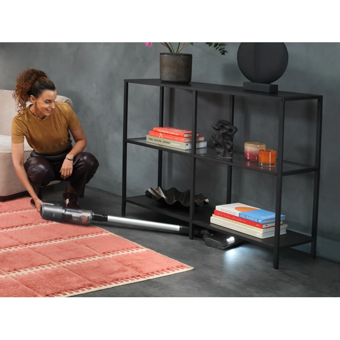 Cordless cleaner designed for easy cleaning under furniture.